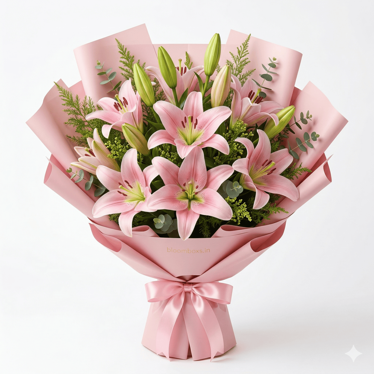 Pink Oriental lily bouquet with green foliage, wrapped in pink paper with a matching satin ribbon, by BloomBoxs.